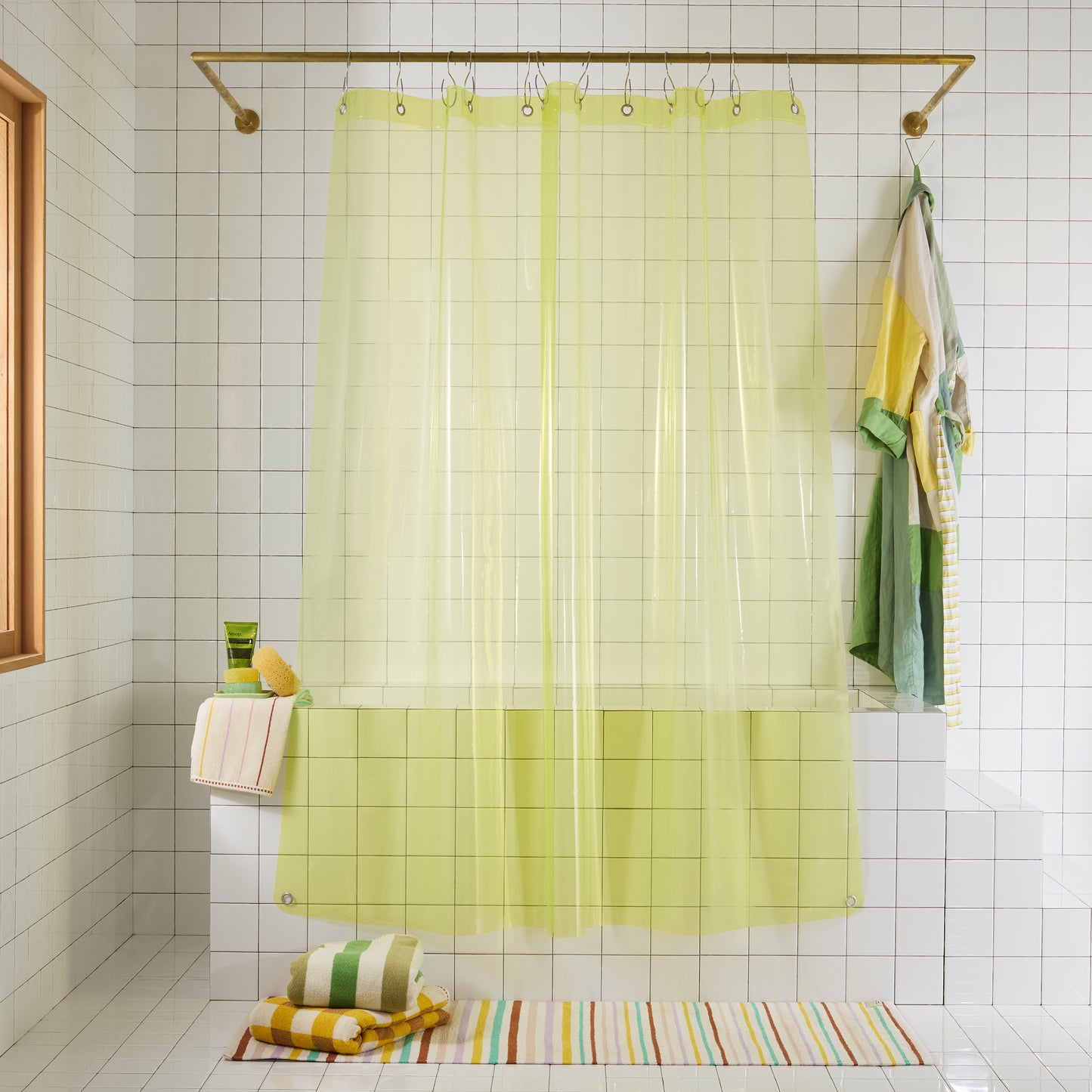 transparent neon yellow shower curtain hanging white bathroom