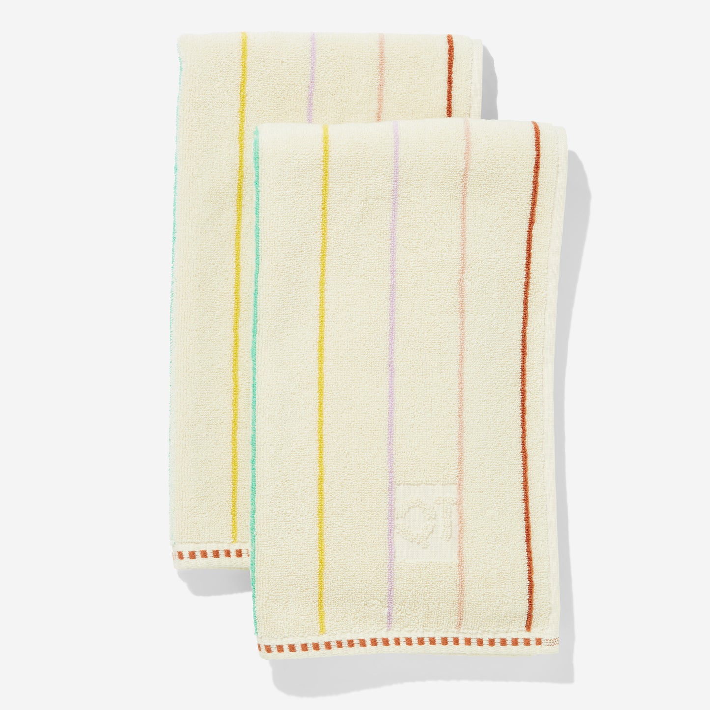 Set of two cream-colored hand towels with colorful stripes on a white background