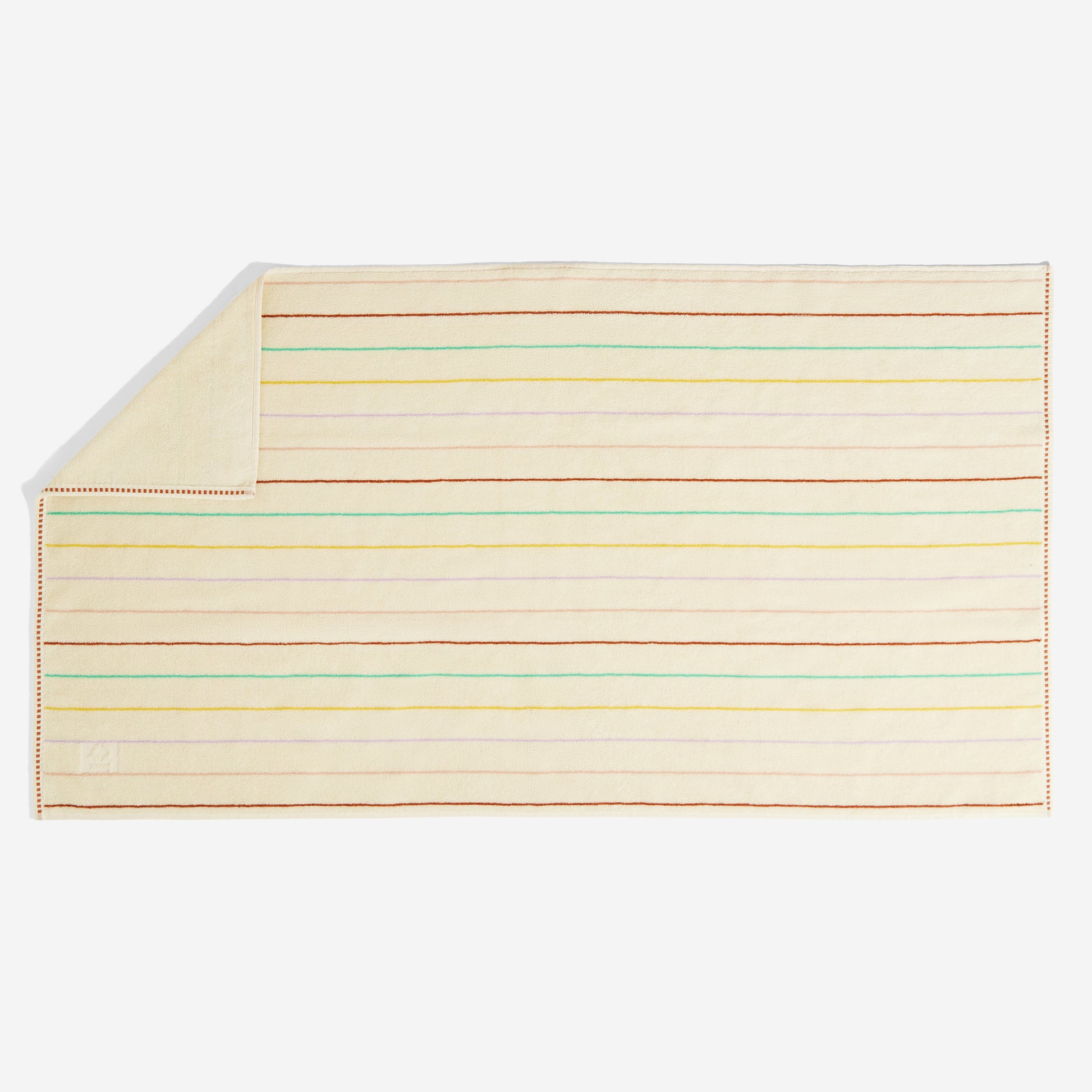 Bath towel with colorful striped pattern on a white background