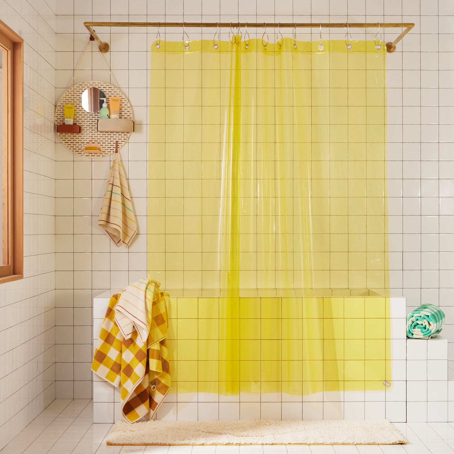 Full length Sunny Sun Shower curtain styled with our Spot shower organizer in Sand, Prism hand towel and bath towel, Tam Canyon bath sheet and Tam Pine bath sheet. 
