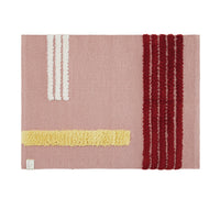 rose colored rug with yellow stripe, 3 white stripes, 3 burgundy stripes. 