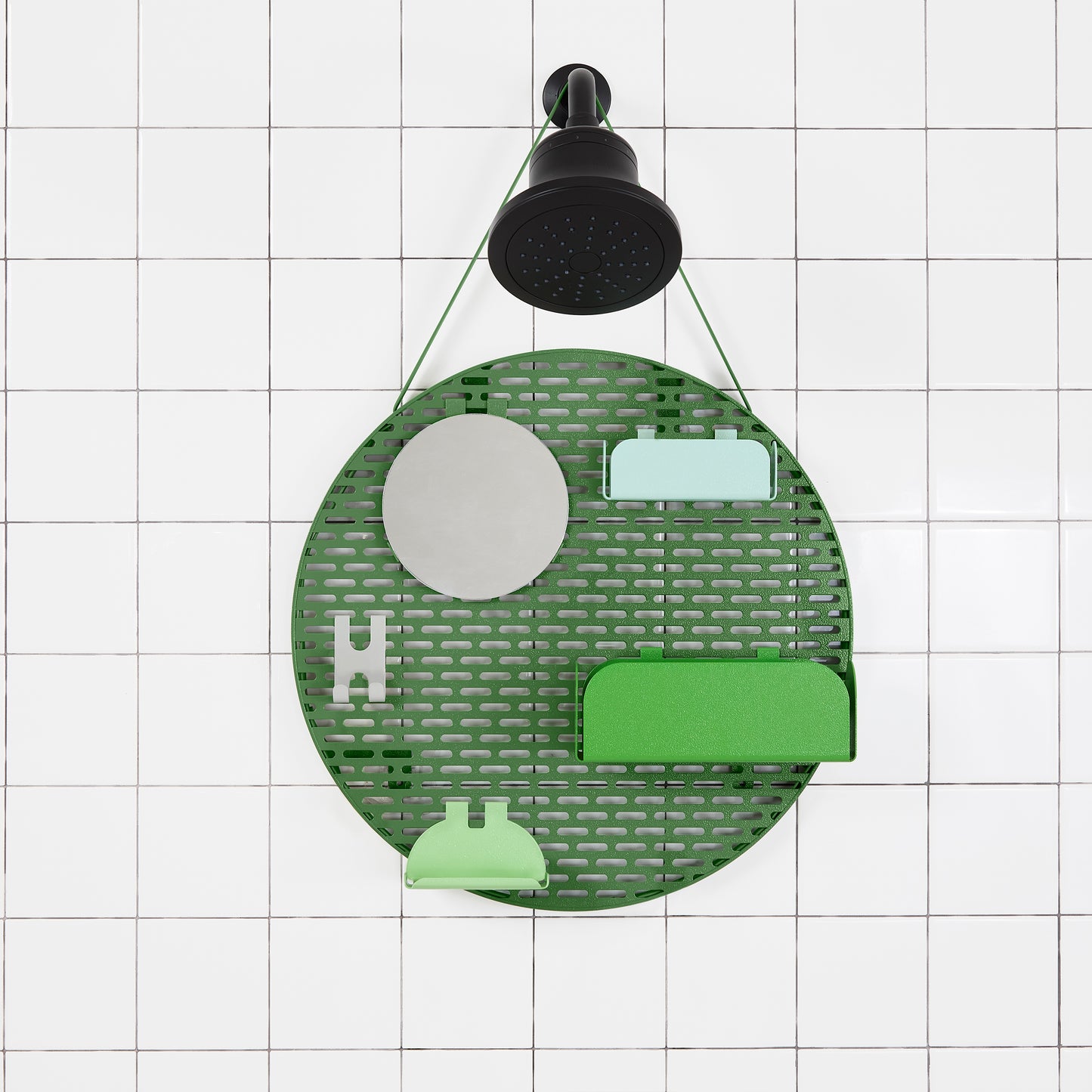 The spot modular shower organizer with shelving pieces arranged hanging in a white tiled shower.