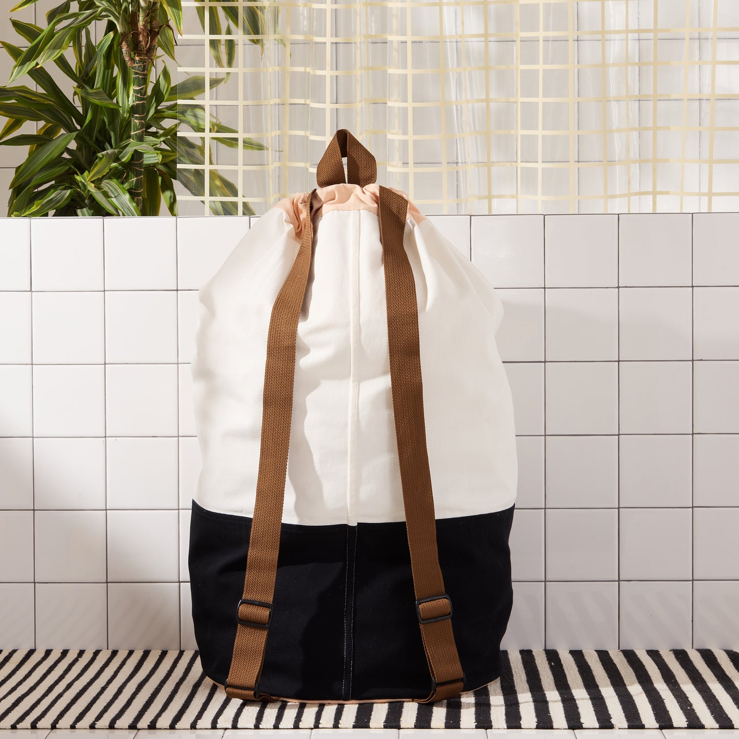 back of laundry back pack with brown straps