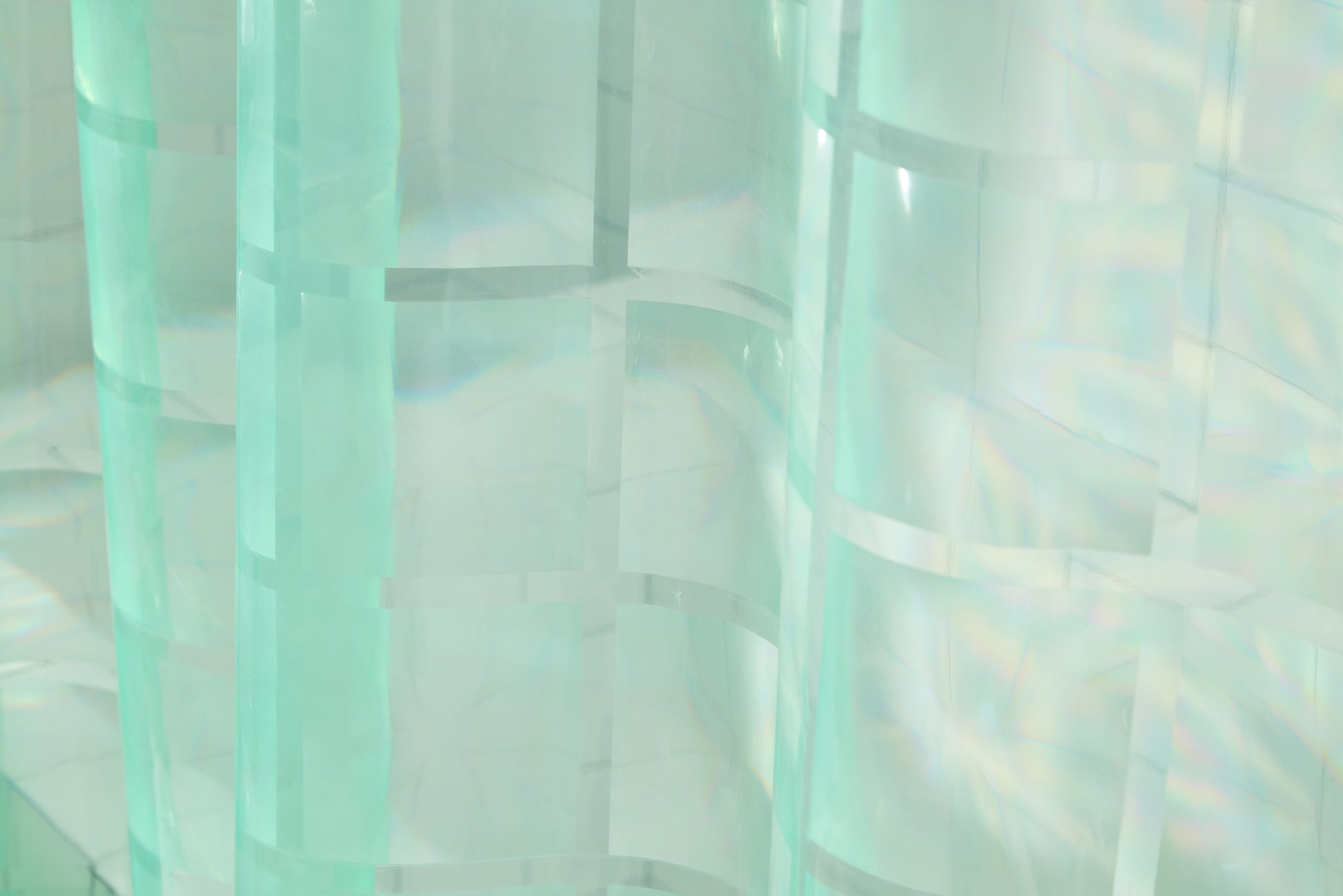 photo of mint sun shower material with embossed grout lines to show glass brick style. 