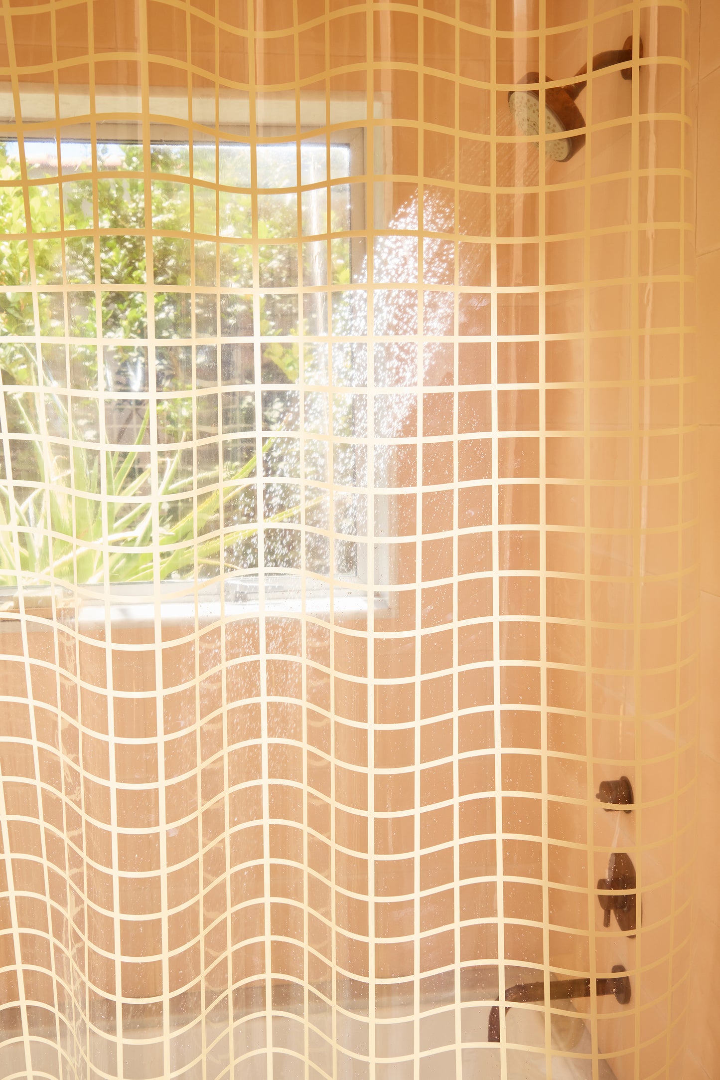 Shower curtain with grid pattern in a bathroom setting