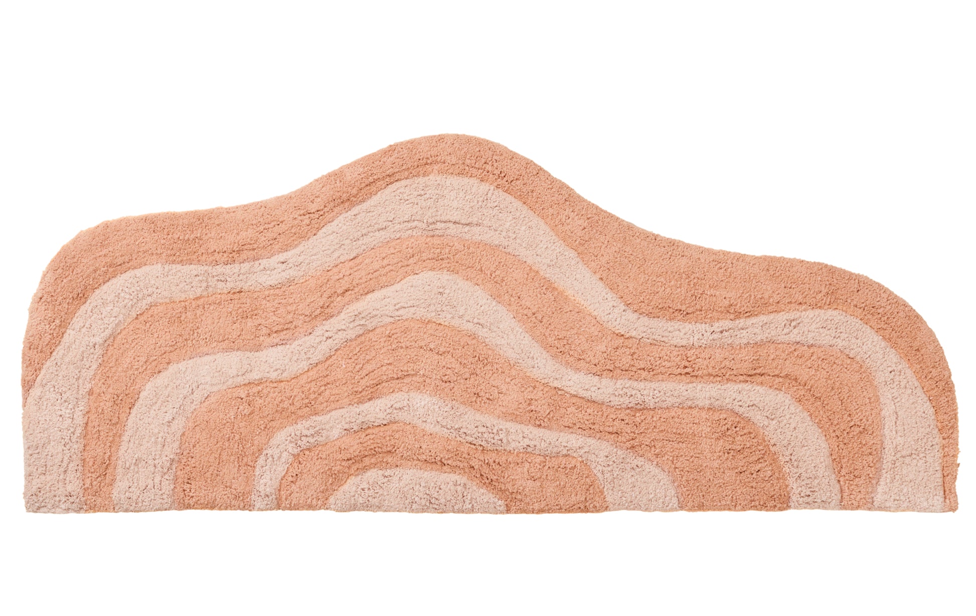 Peach long bath mat with wavy pattern on a white background