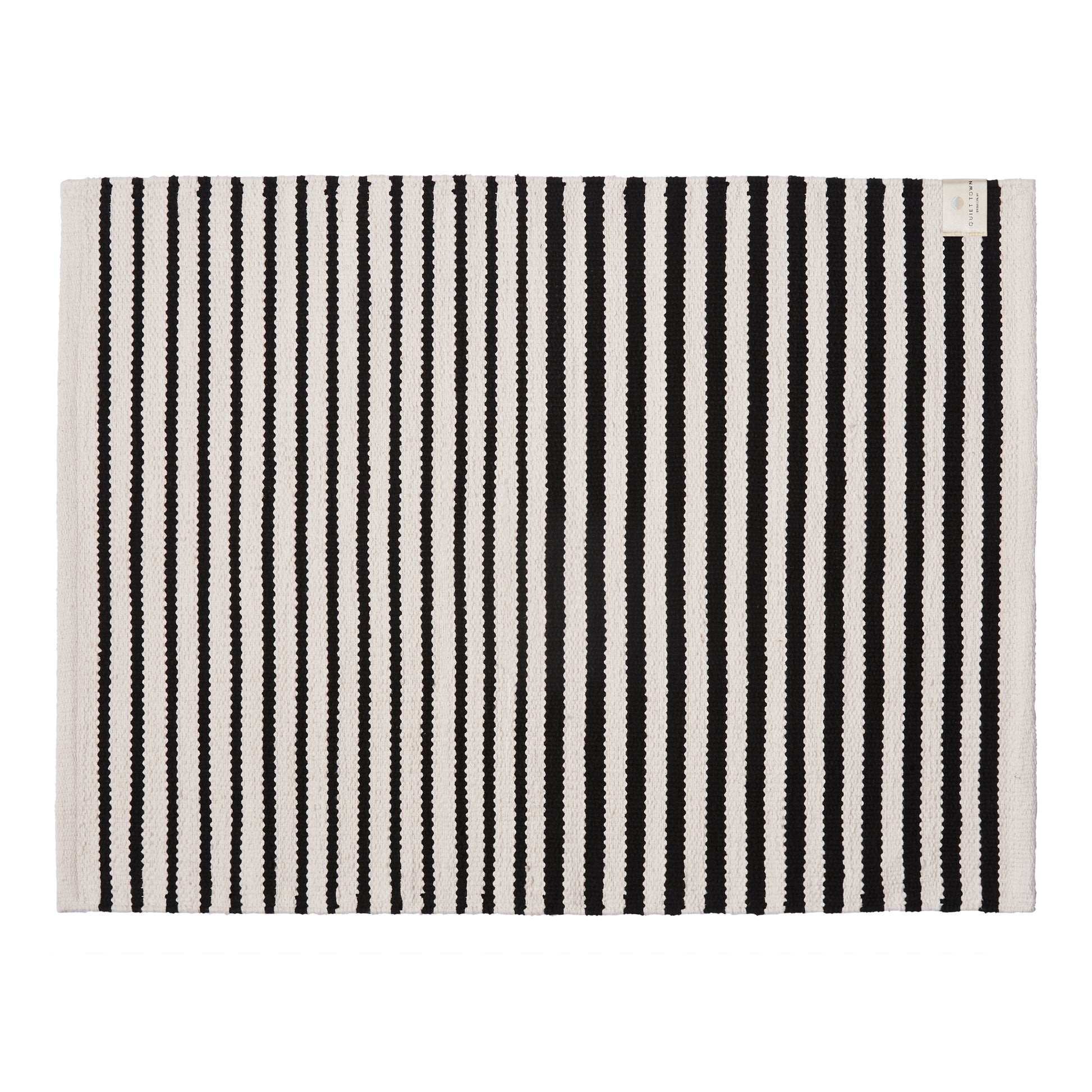 Black and white striped rug on a white background