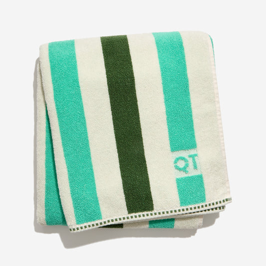 Catalina bath sheet in pine folded against a white background. 