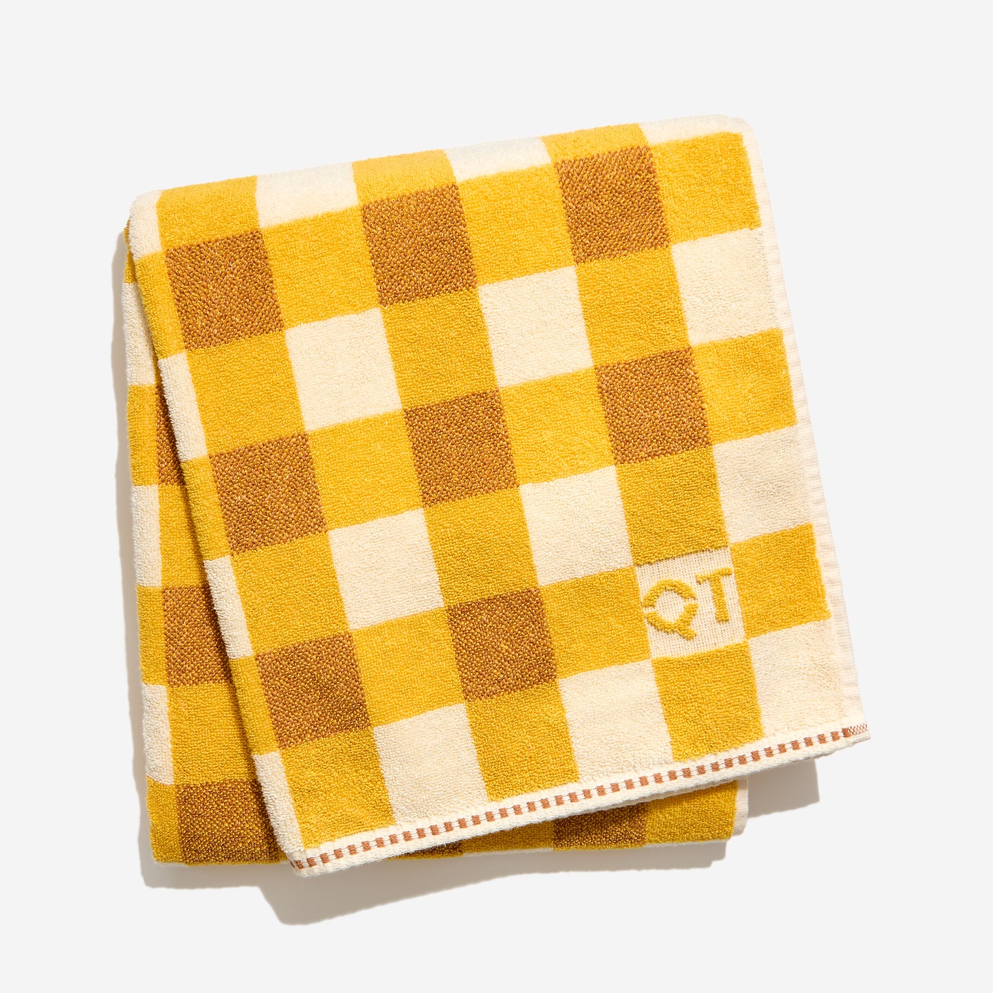 Tam bath sheet in canyon folded against a white background. 