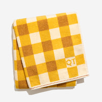 Tam bath sheet in canyon folded against a white background. 