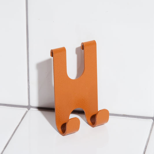 Aluminum razor holder hook in clay.