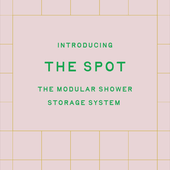 Video illustration of The Spot in "pine" hanging from a shower head on a tiled wall with the baskets and components showing modularity. 