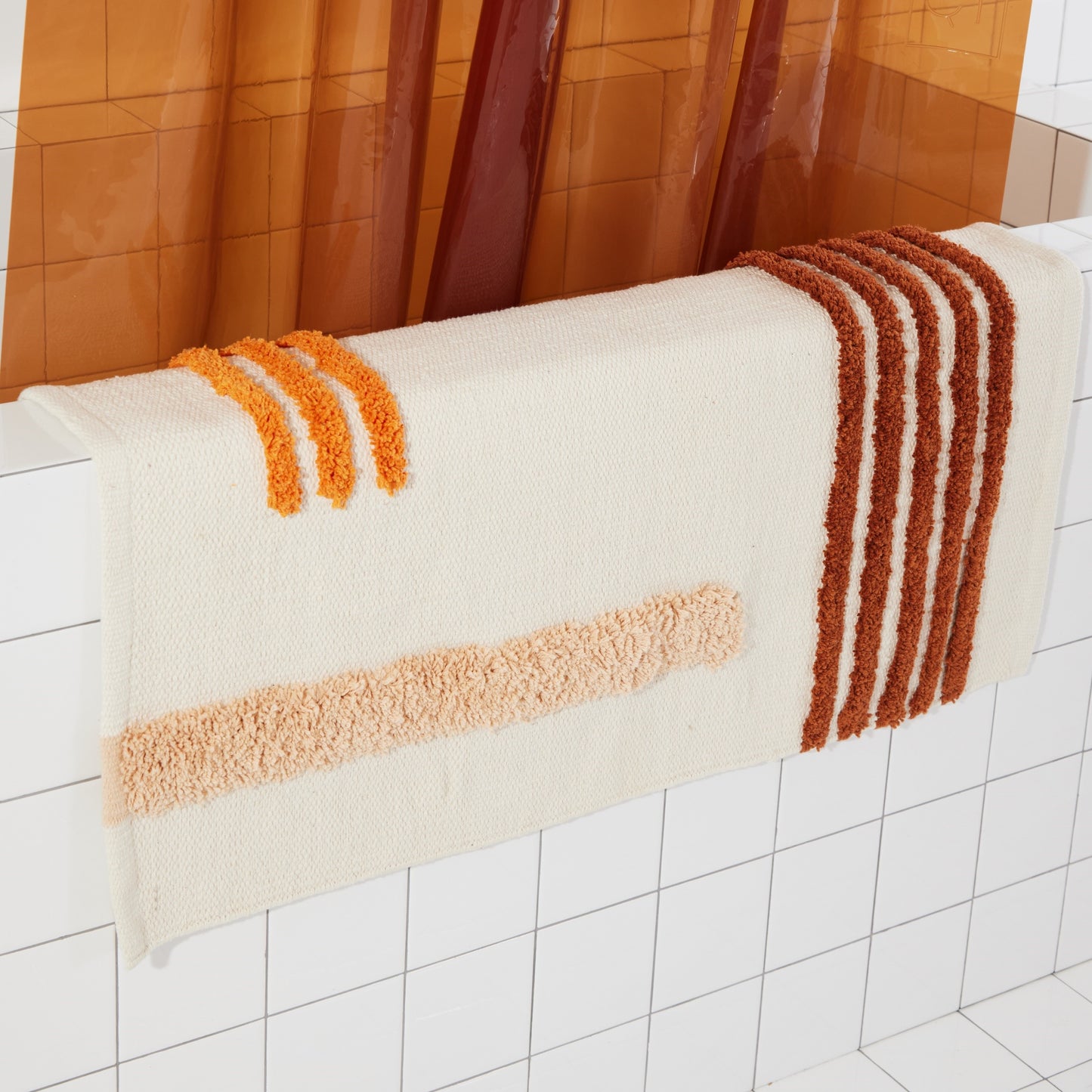 Reyes Clay draped on side of the bath tub
