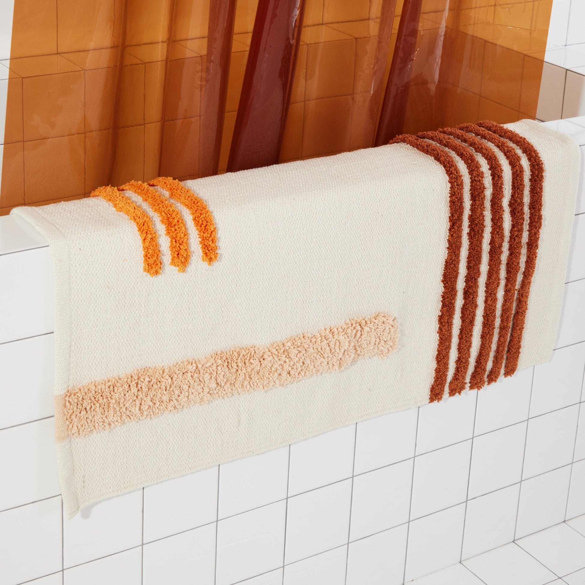 Reyes Clay draped on side of the bath tub