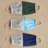 Kids Pine Masks flat on floor