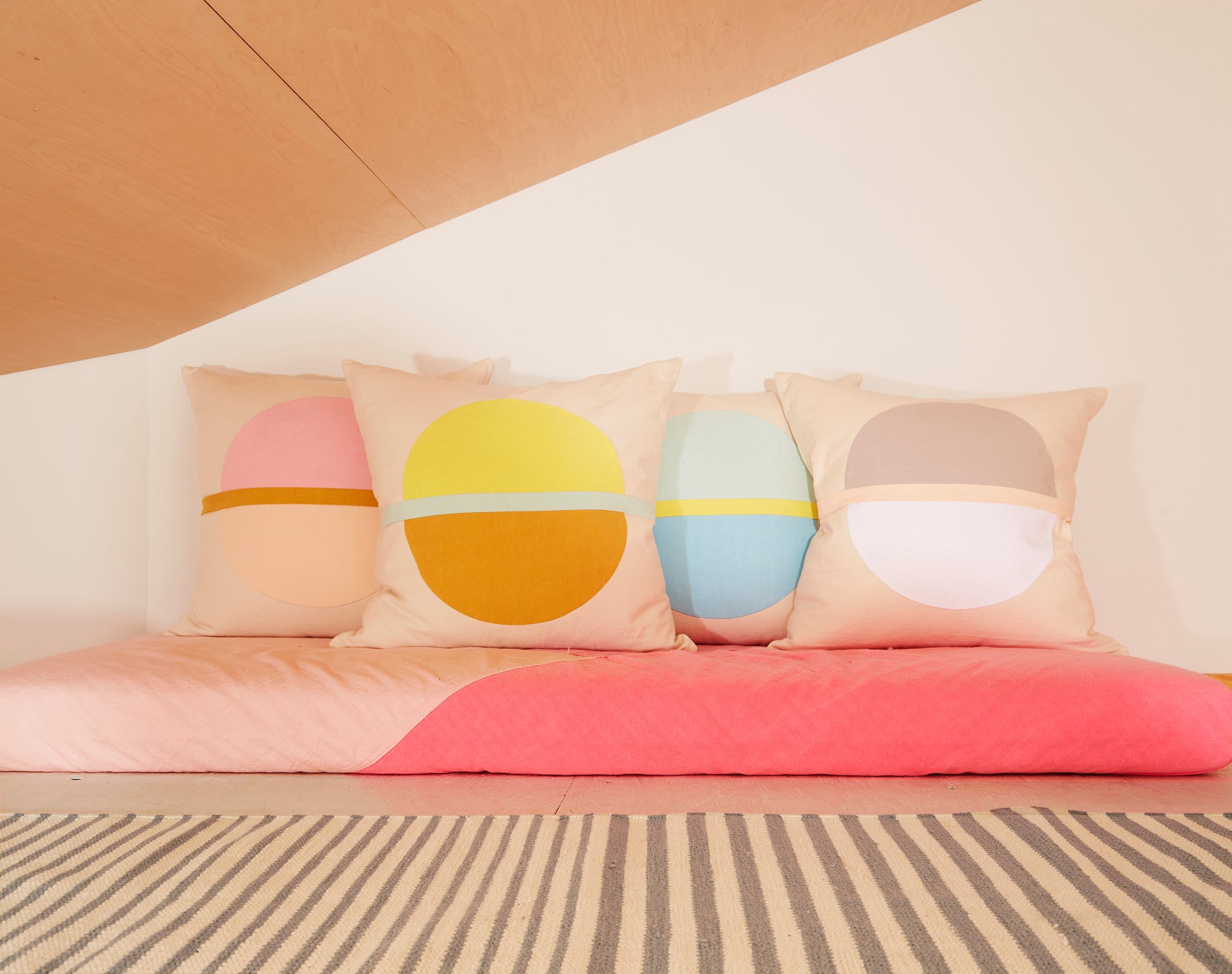 Re:Canvas Arco Canyon Square Pillow placed in bed