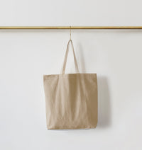 Re:Canvas Tote Hidden Beach front view hanging on rod