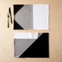 Narlai Night Ride Placemat flat on table with tableware